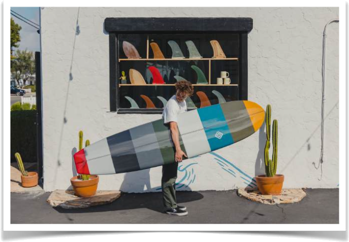 Almond Surfboards shopfront with a custom surfboard